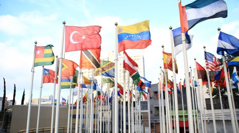 International flags flying in a city, the governments now doing frontier AI testing