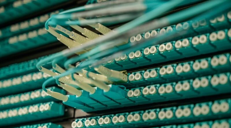 Fibre optic cables into a server rack, the plumbing of AI agent infrastructure funding