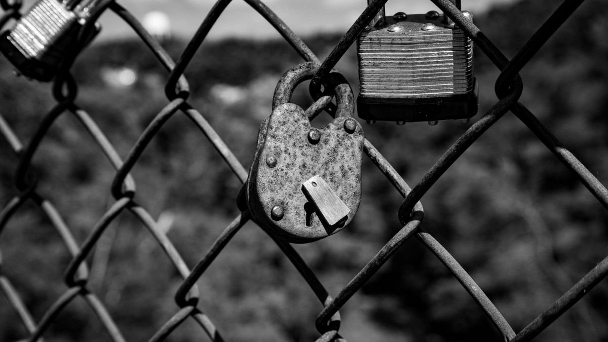 Rusty padlocks on a fence, the closed half of the open weight vs closed models question