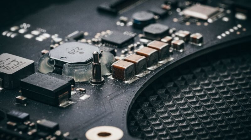 A macro shot of an electronic circuit board, at the centre of the AI compute shortage
