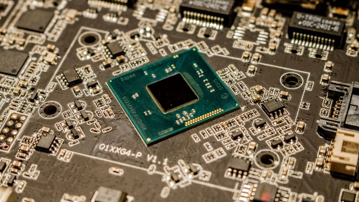 A microchip on a circuit board, the hardware behind flagship vs entry tier models
