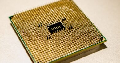 A golden microprocessor seen close up, the silicon behind frontier model benchmarks