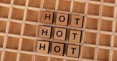 Wooden letter tiles spelling a word on a grid, the unit-splitting that tokenisation performs