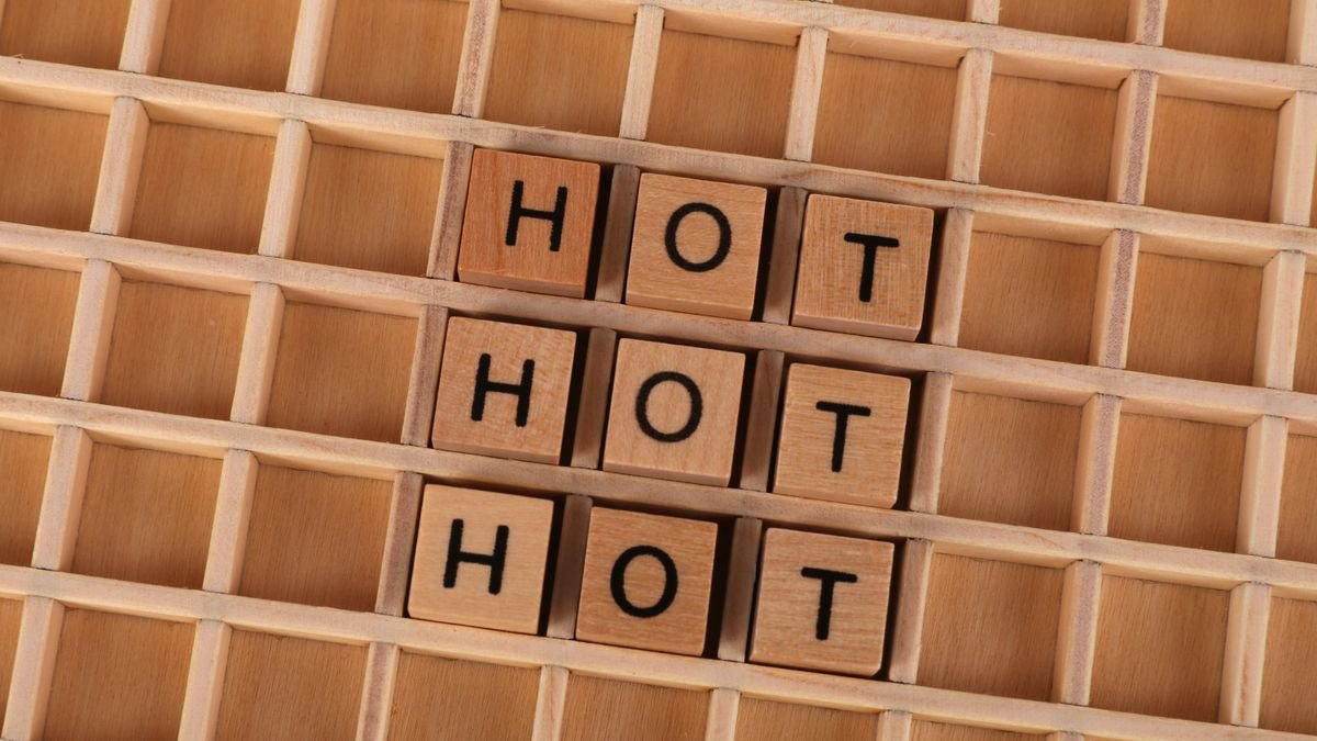 Wooden letter tiles spelling a word on a grid, the unit-splitting that tokenisation performs