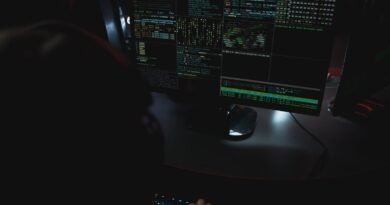 Code on monitors in a darkened room, the environment Meta Muse Code writes into
