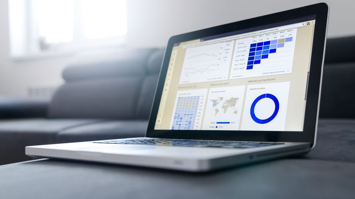 A laptop showing analytics and graphs, the presentation layer of AI benchmarks