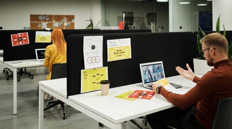 Colleagues collaborating in a modern office, the roles affected by AI entry level hiring