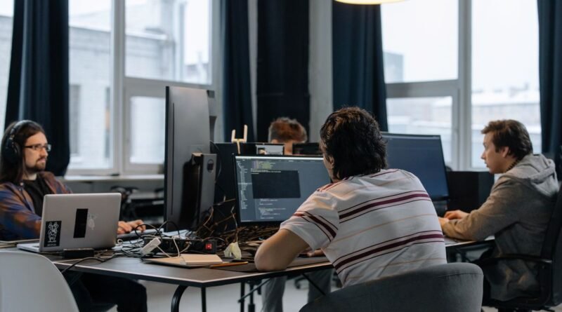 Developers working together in a tech office, the team behind the Cognition valuation