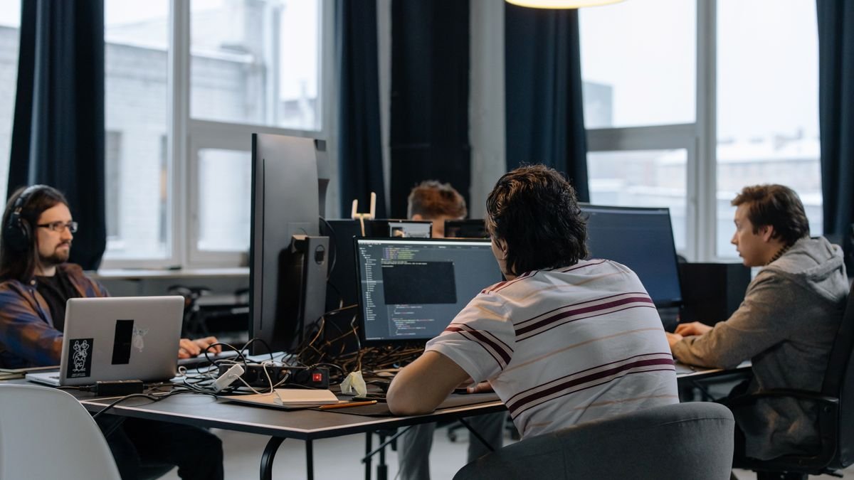 Developers working together in a tech office, the team behind the Cognition valuation