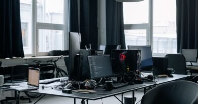 A workspace of computers and coding screens, where enterprise AI deployment succeeds or fails