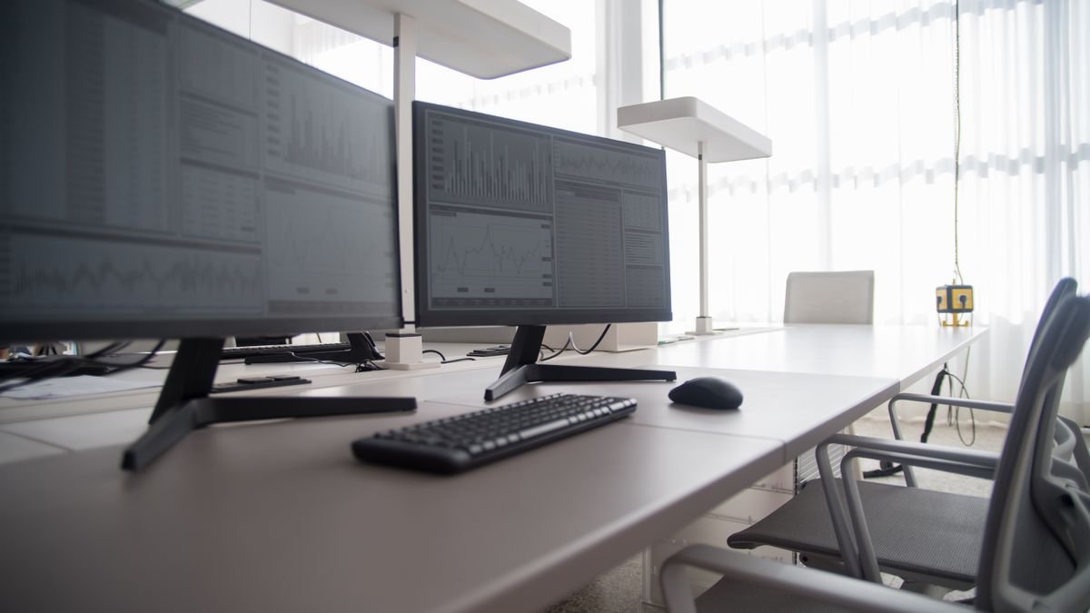 Rows of monitors in a contemporary office, the buyers Meta enterprise AI is aimed at