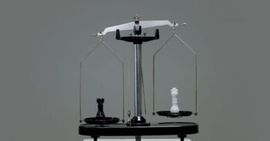 Chess pieces balanced on a scale, weighing AI model pricing against benchmark scores