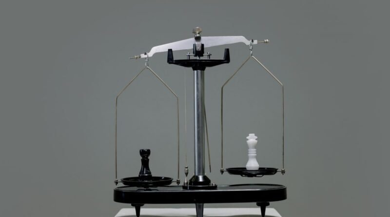Chess pieces balanced on a scale, weighing AI model pricing against benchmark scores