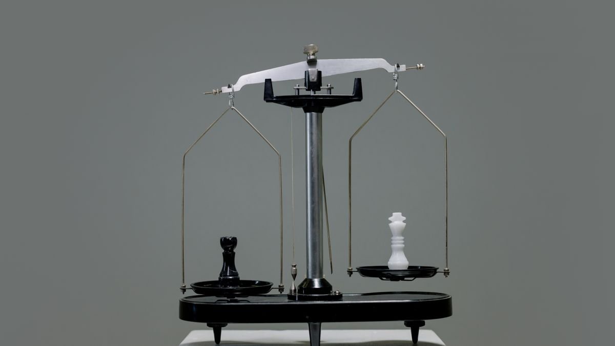 Chess pieces balanced on a scale, weighing AI model pricing against benchmark scores