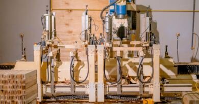 Automated woodworking machinery drilling timber parts, the kind of small-business automation this Runable funding round will scale