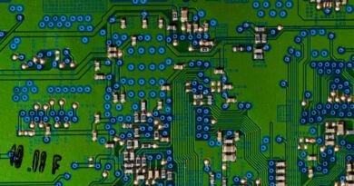 Circuit board illustrating AI hypothesis generation in a multi-agent research pipeline that lost to plain self-reflection.