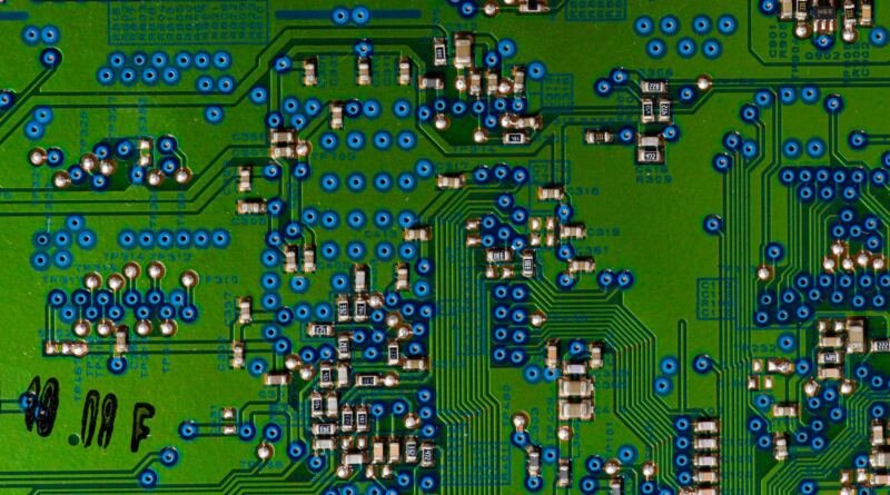 Circuit board illustrating AI hypothesis generation in a multi-agent research pipeline that lost to plain self-reflection.