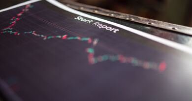 A printed stock report with a candlestick chart, illustrating the trends behind the OpenAI revenue figures reported for Q2