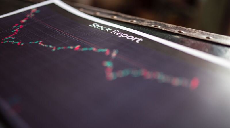 A printed stock report with a candlestick chart, illustrating the trends behind the OpenAI revenue figures reported for Q2
