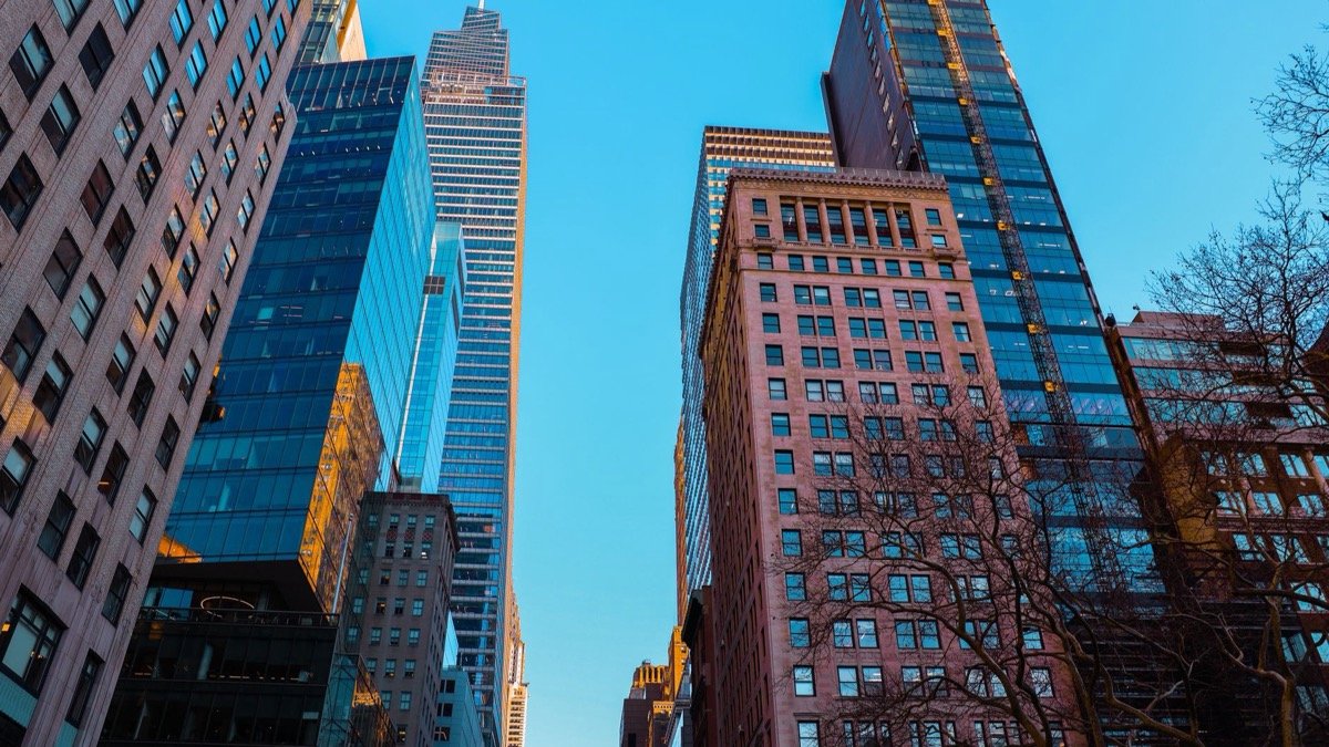 Manhattan skyscrapers under a clear sky, the kind of data center real estate Starcloud's orbital data centers are built to bypass