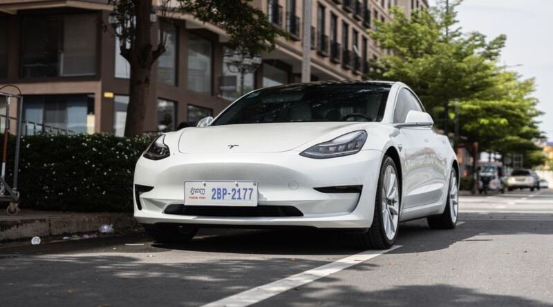 White Tesla Model 3 parked on a city street, among the vehicles covered by Tesla's recall in China