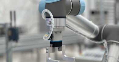Industrial robot arm standing in for Apple's Agent Seer benchmark of 337 agent test scenarios