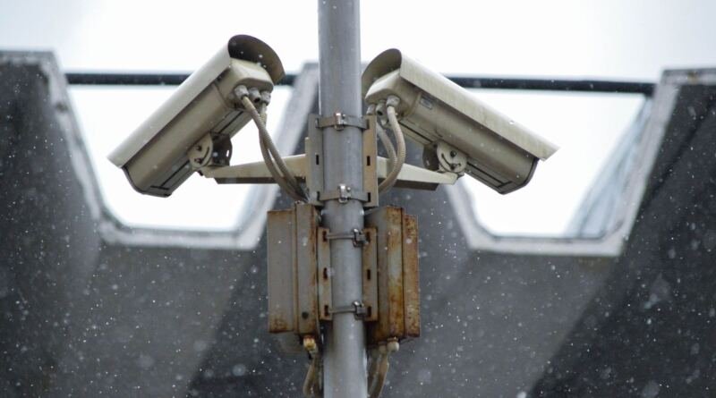 Surveillance camera artwork illustrating why Anthropic and OpenAI need independent embedded AI evaluators