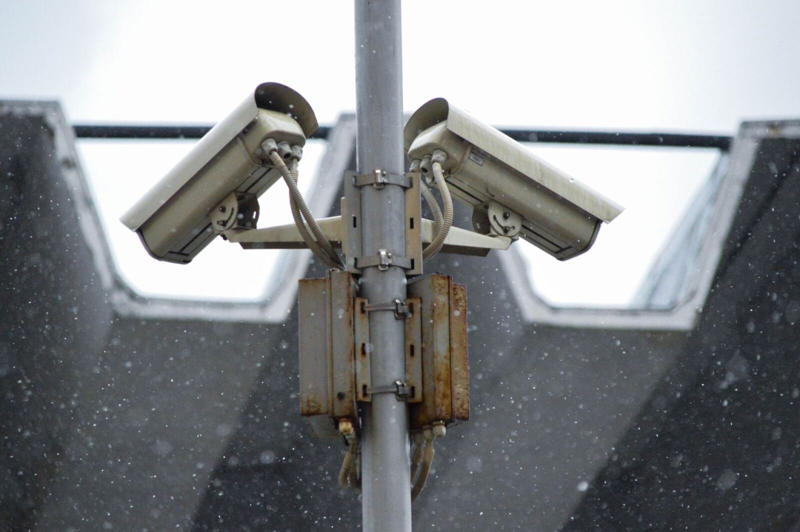Surveillance camera artwork illustrating why Anthropic and OpenAI need independent embedded AI evaluators