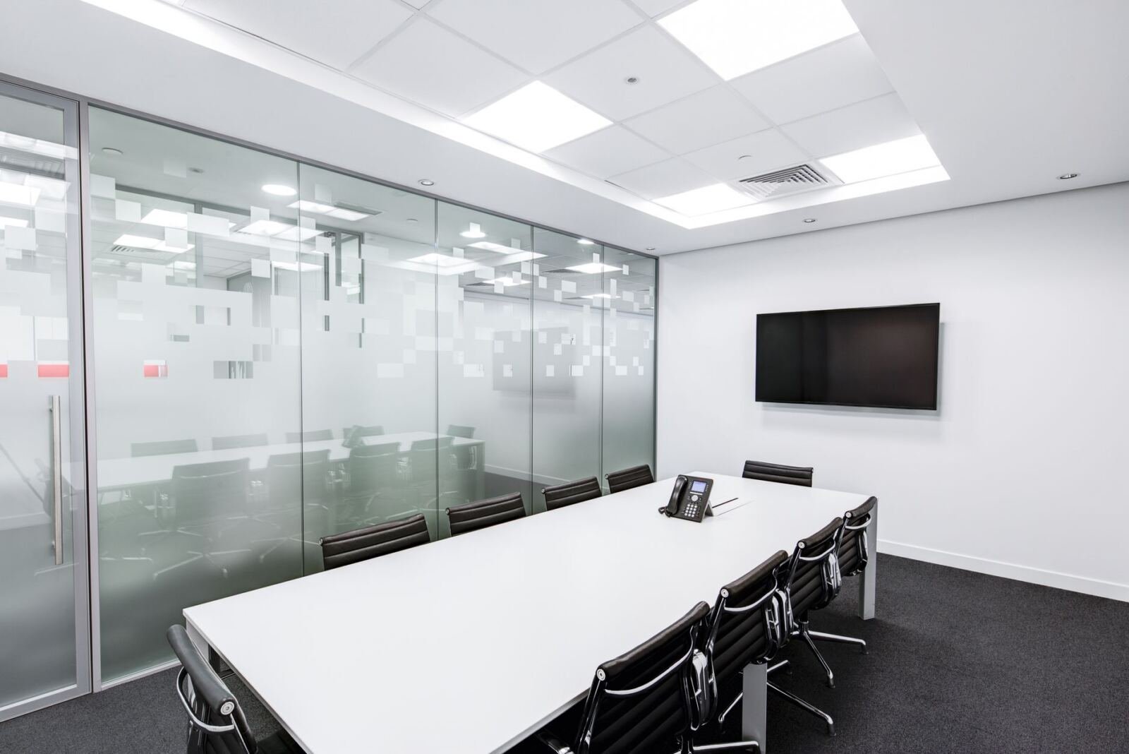 Meeting room, illustrating proactive cyber defense for governments and enterprises