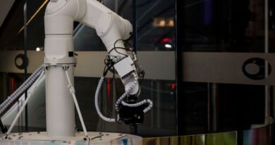 Robotic arm, illustrating the AppWorld consistency gap: will it ace the task again?