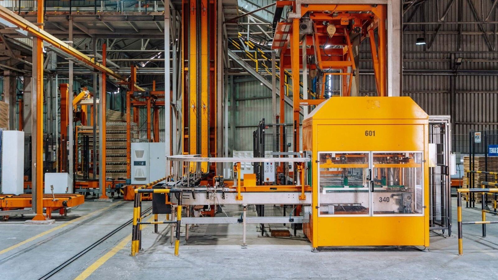 Automated machinery on a factory floor, illustrating Bank of America Mythos remediation
