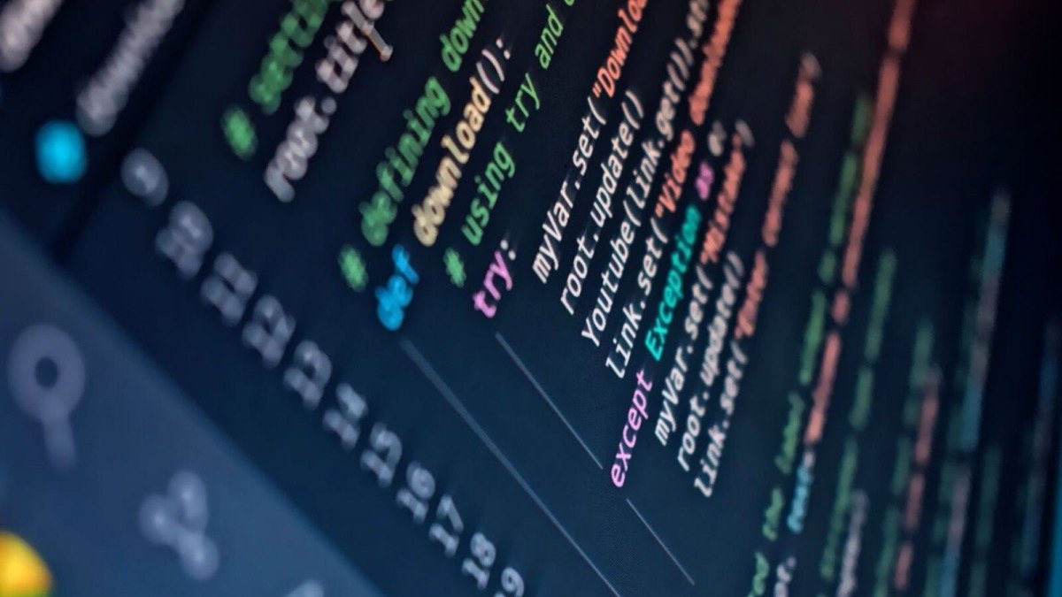 Syntax-highlighted code on an angled monitor, illustrating the Manus funding round