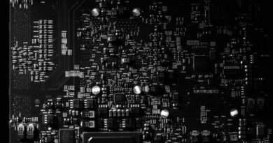 Densely packed black and white circuit board, illustrating multi-turn reinforcement learning on Amazon SageMaker AI
