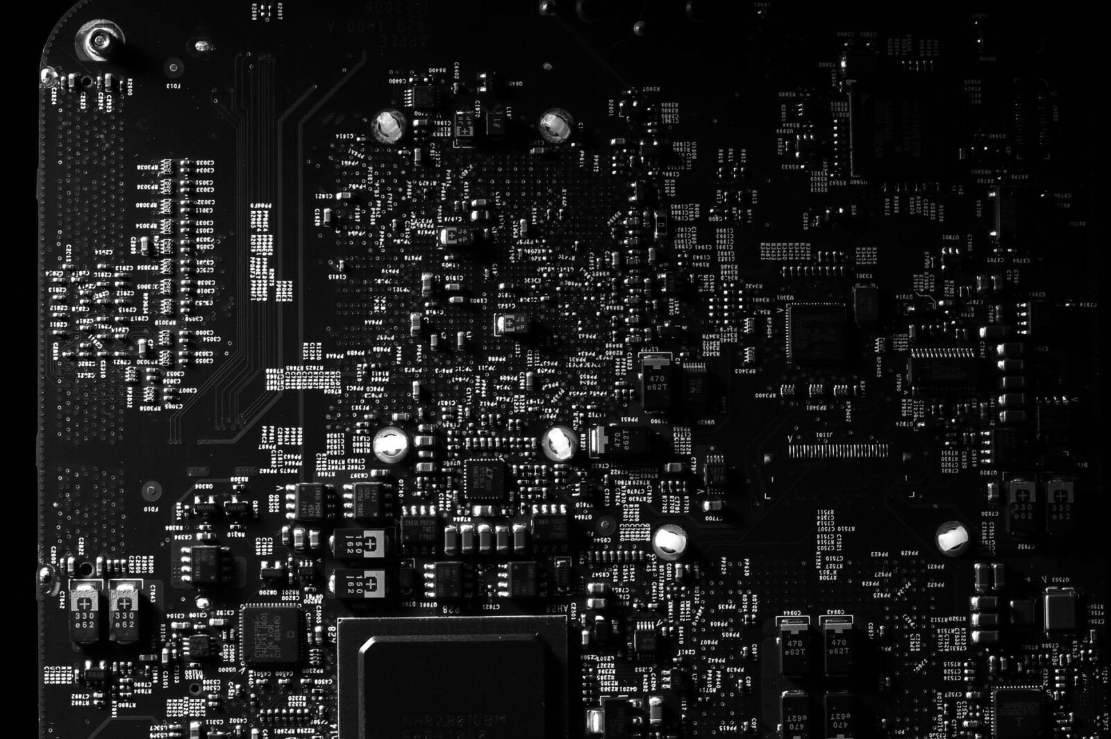 Green circuit board close-up, illustrating Apple SelfCompact agent context compaction