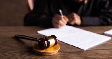Gavel and signed court papers on a wooden bench, illustrating the Character.AI bankruptcy
