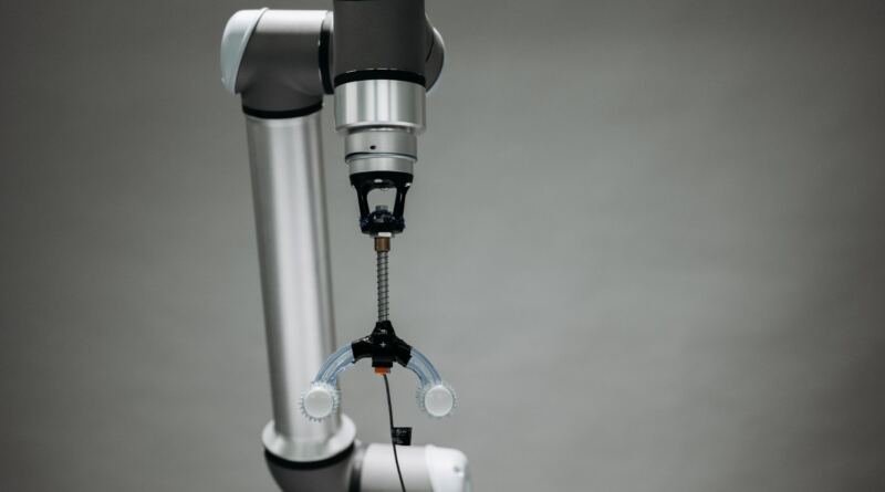 Robotic arm illustrating OpenAI Dots Europe, locked out for Pro subscribers in the EEA and UK.