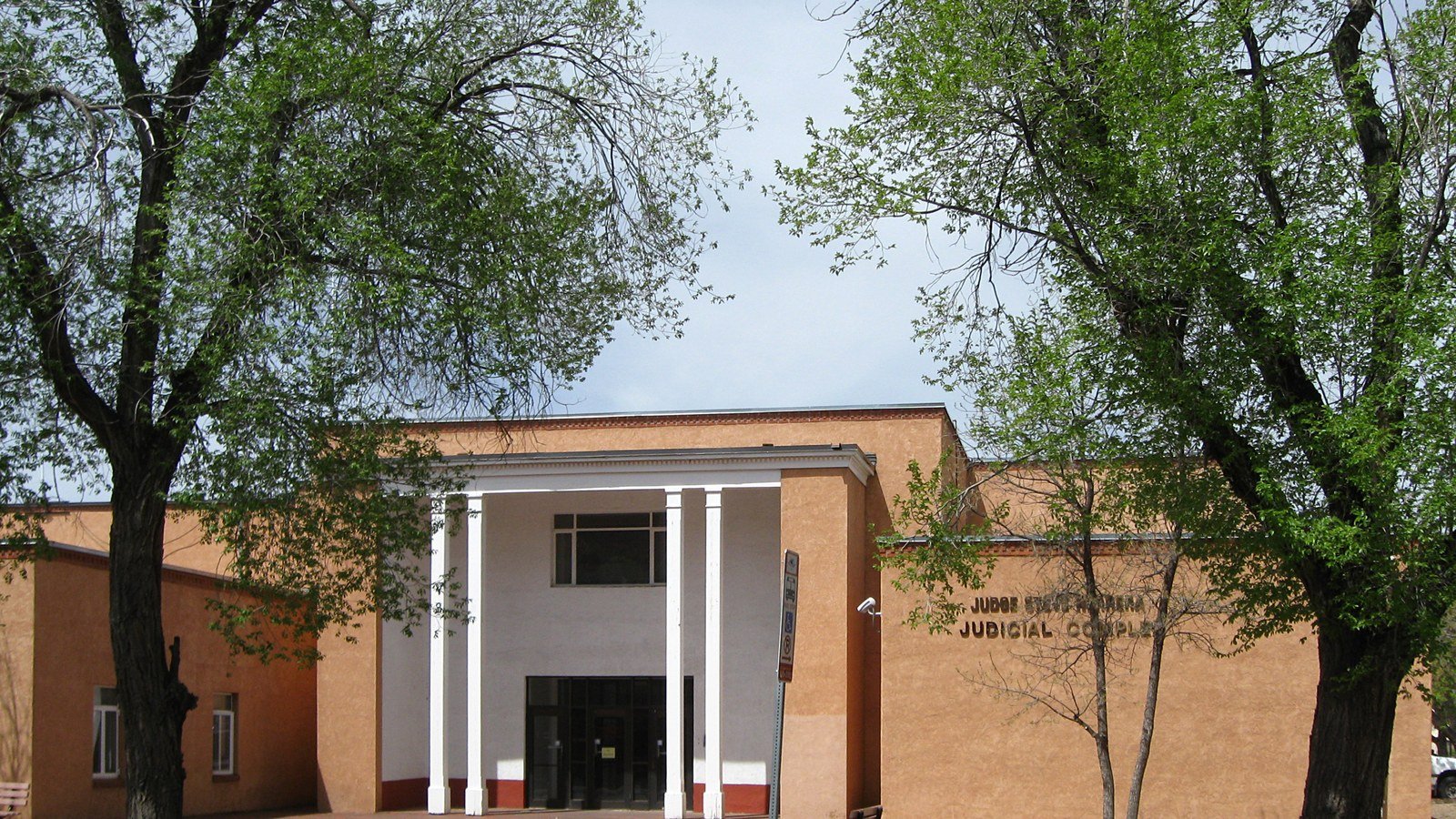 Adobe courthouse with white columns in Santa Fe, illustrating the Meta New Mexico penalty