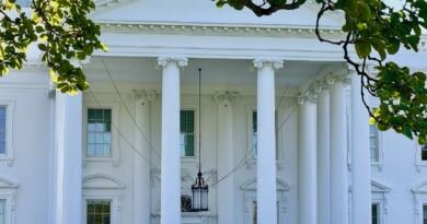 The North Portico of the White House seen through a magnolia branch, illustrating the Super Intelligence executive order
